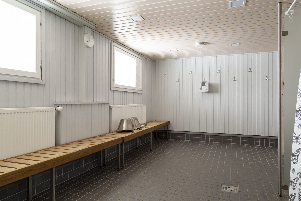 Sauna shower room with long benches.